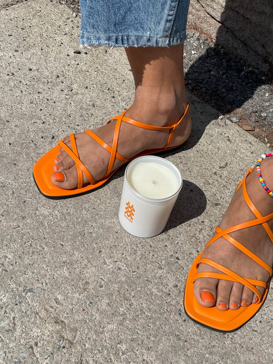Maguire X Lohn candle photograph with orange sandals
