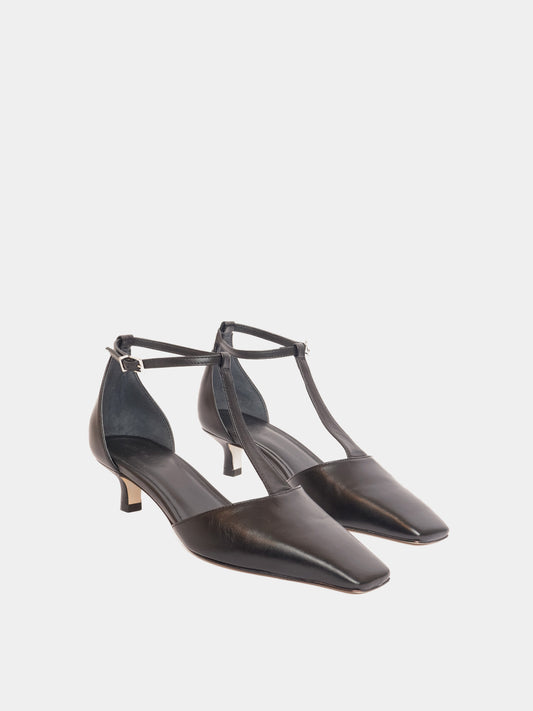 Ecom image of a black T bar heel with short heel, angle view.