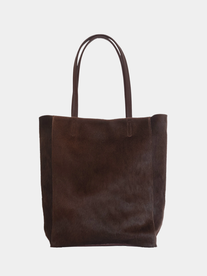 Carpi large tote bag with brown pony hair and brown leather straps, front view.