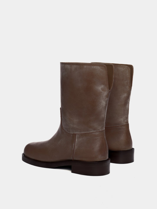 brown boot on light gray background