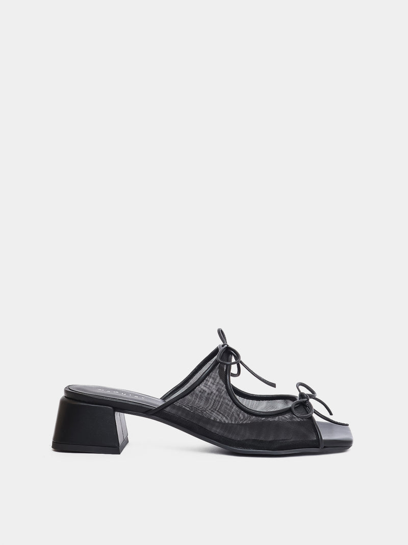 Black shoe with mesh design on a light gray background