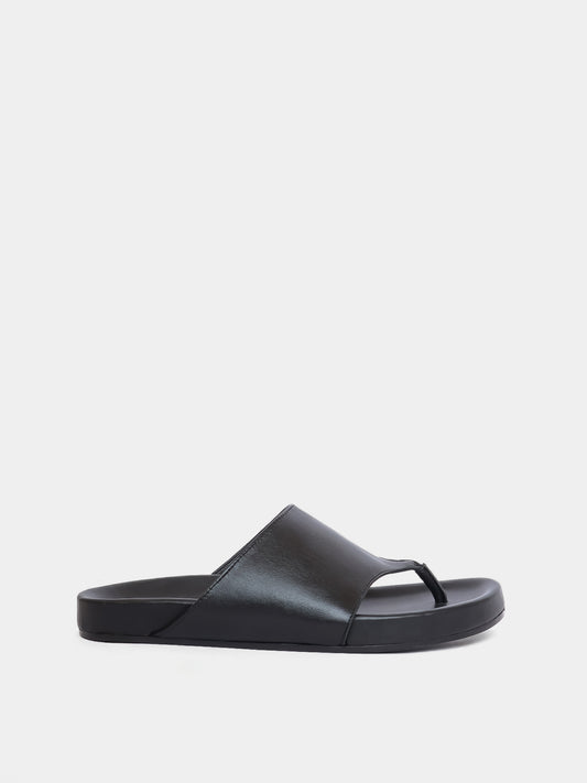 black flip flop on grey background