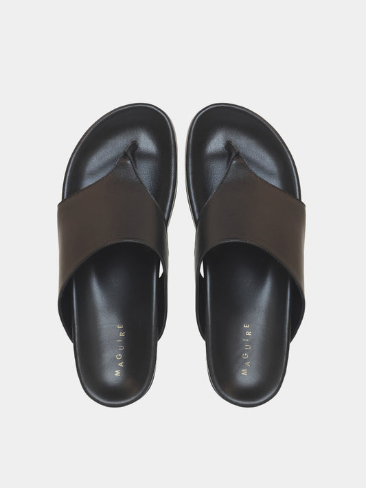 black flip flop on grey background