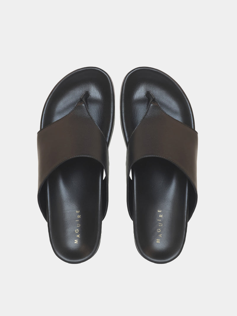 black flip flop on grey background