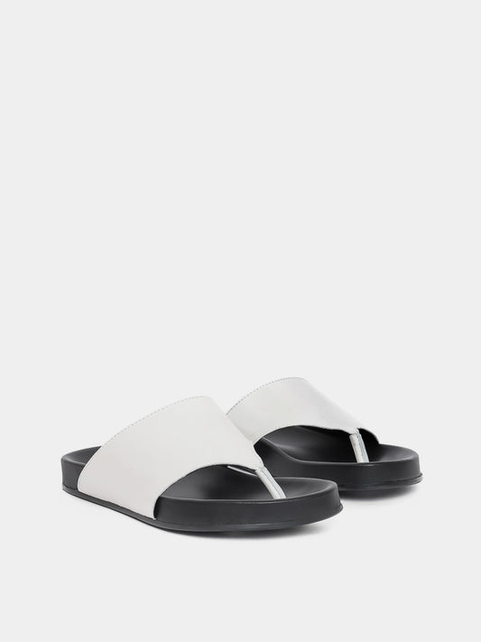 cream flip flop on grey background