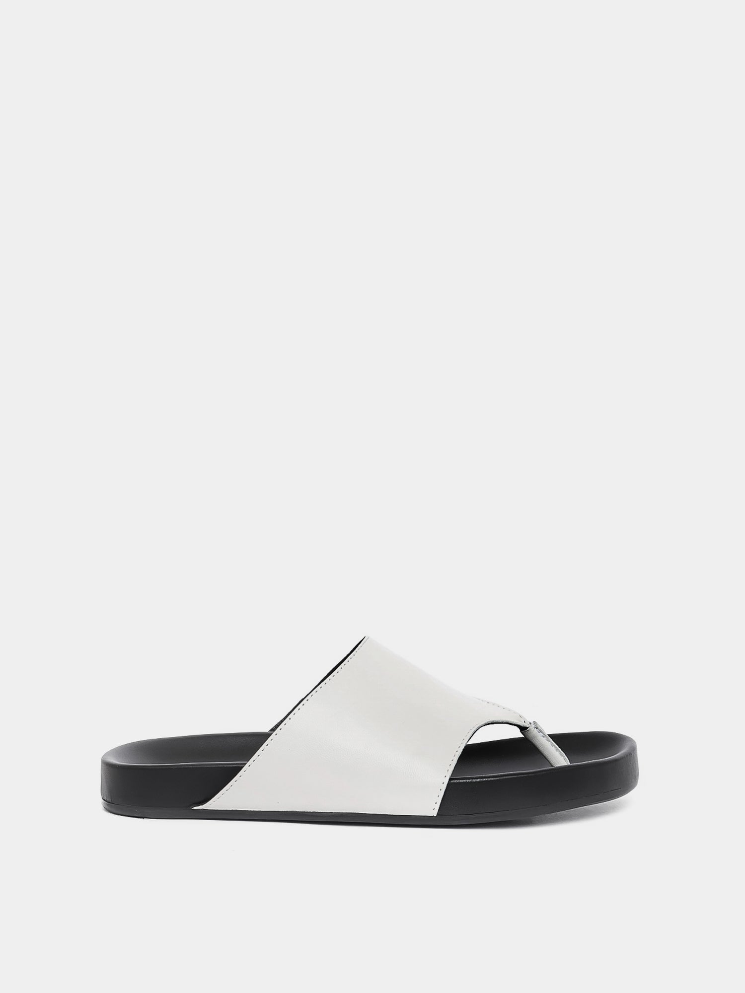 cream flip flop on grey background