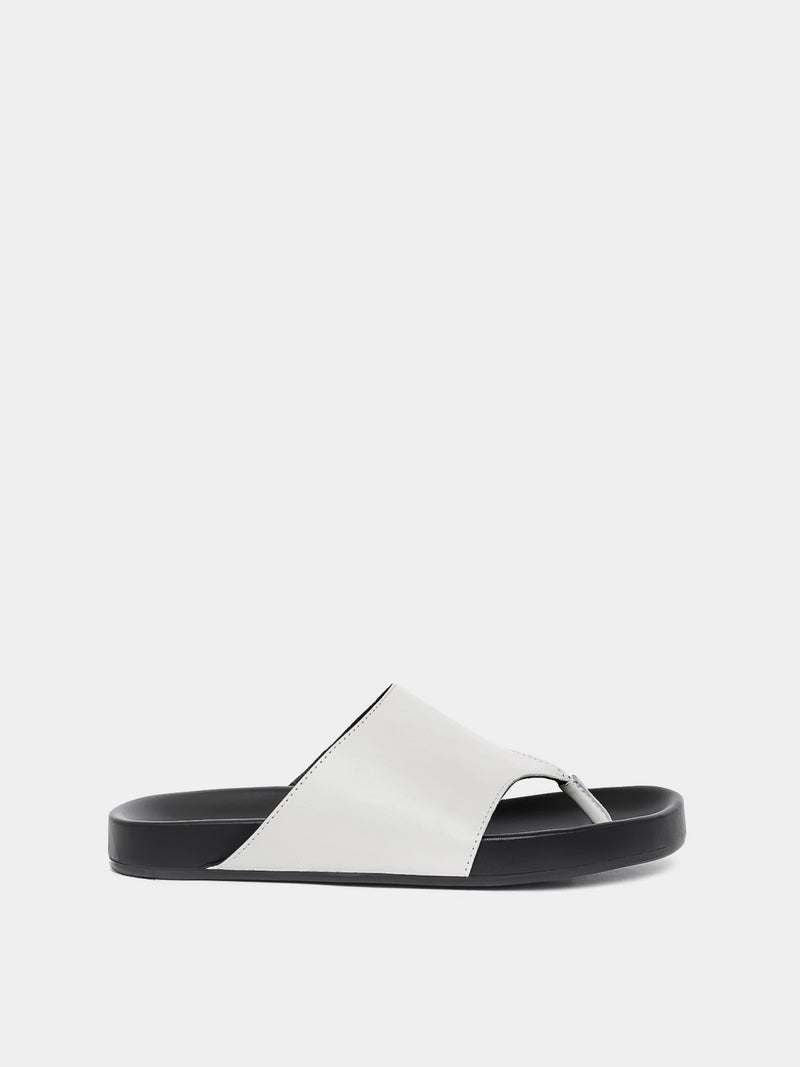 cream flip flop on grey background