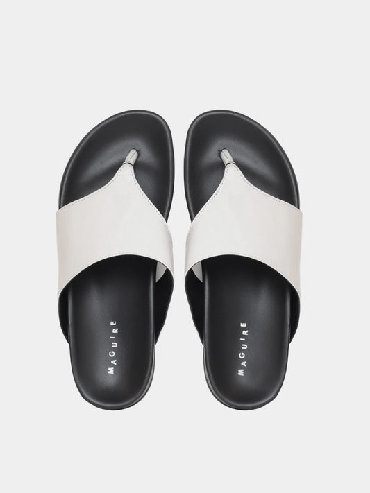 cream flip flop on grey background