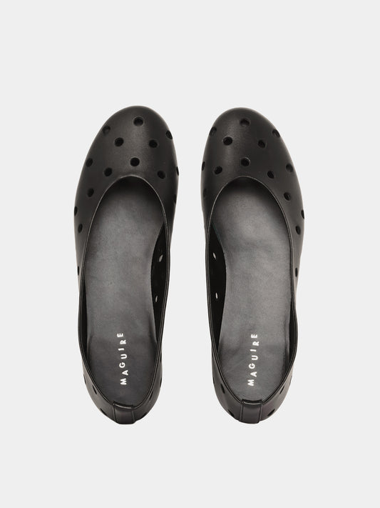 black ballet flat with round cutouts