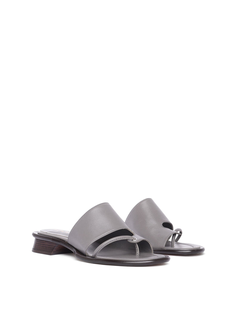 A pair of gray Mallorca slate sandals with a low heel and soft upper, placed against a plain background.