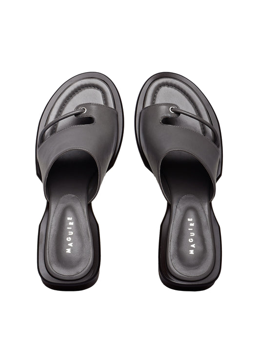 A pair of gray Mallorca slate sandals with a low heel and soft upper, placed against a plain background.
