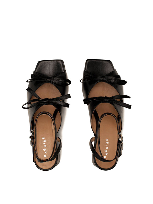 Mira black leather square-toe heel with ankle strap and two bows, top view.