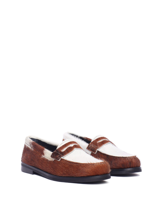 Napoli loafer with cow-print pony hair and black sole, front view.