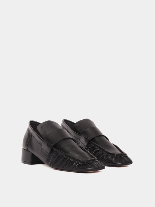 Black leather loafers with a small heel