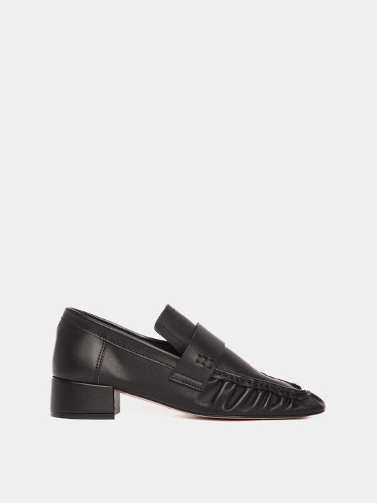 Black leather loafers with a small heel