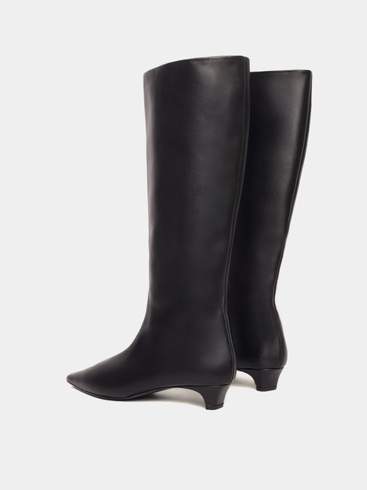 Knee-high black leather boots with a low heel and pointed toes