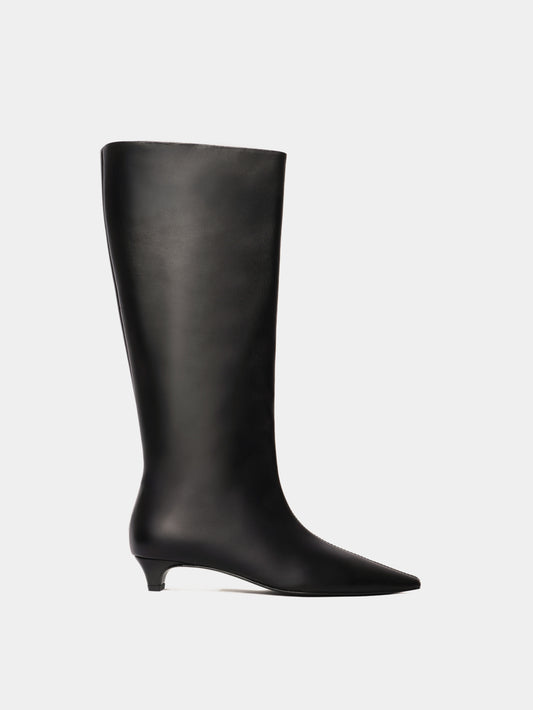 Knee-high black leather boots with a low heel and pointed toes