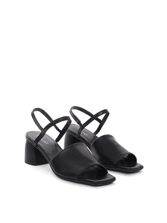 Black leather block heels with an ankle strap