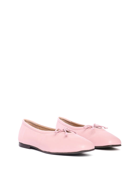 Blush pink leather ballerina flats with a blush pink bow