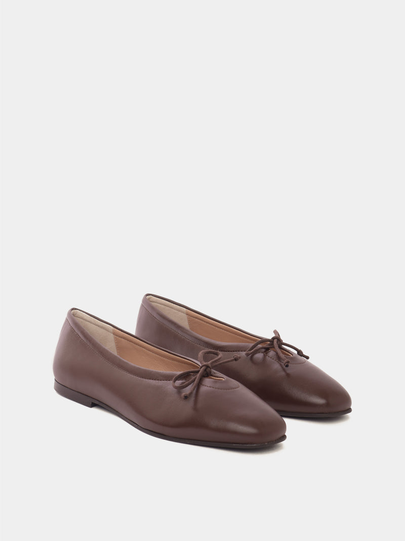 Brown leather ballerina flats with a brown bow