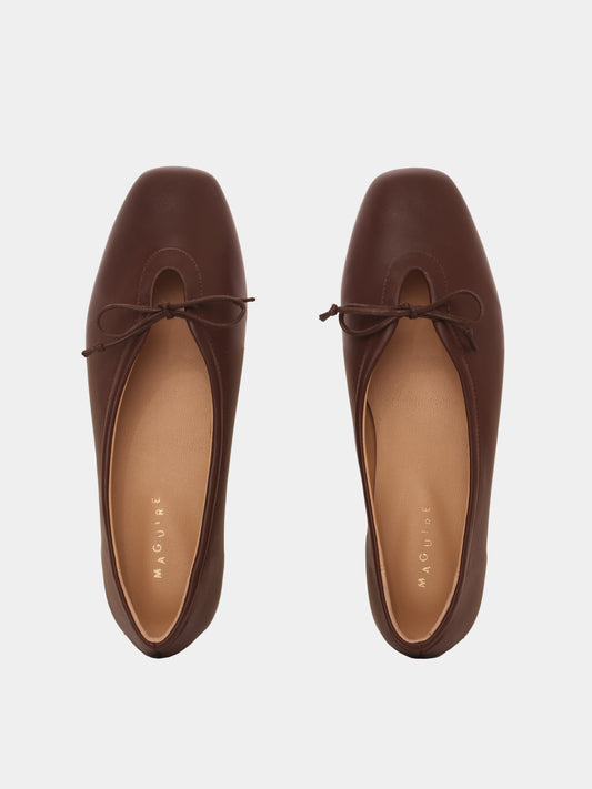 Brown leather ballerina flats with a brown bow