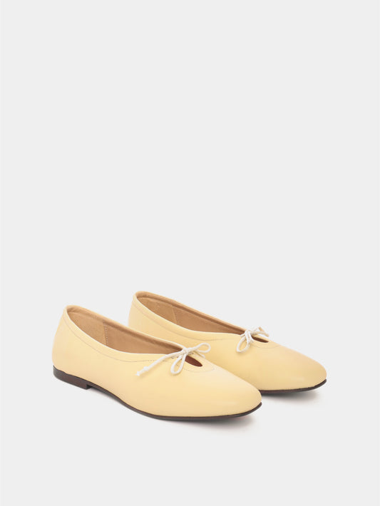Butter leather ballerina flats with a butter bow