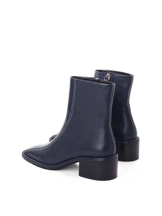 Navy leather ankle boots with white contrast stitching and a block heel