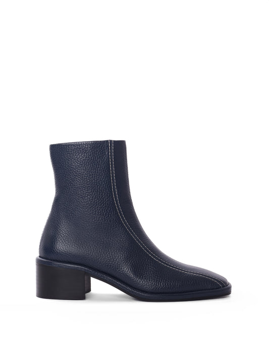Navy leather ankle boot with white contrast stitching and a block heel