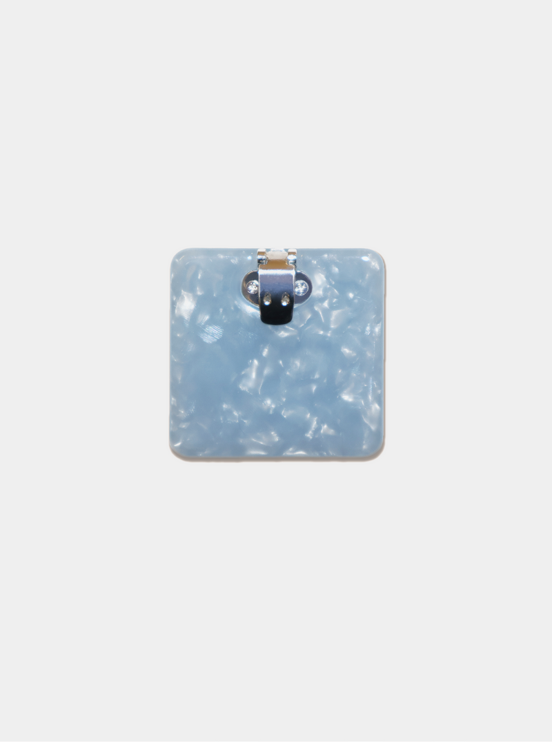 Ecom image of a square blue acetate shoe clip, back clasp view.