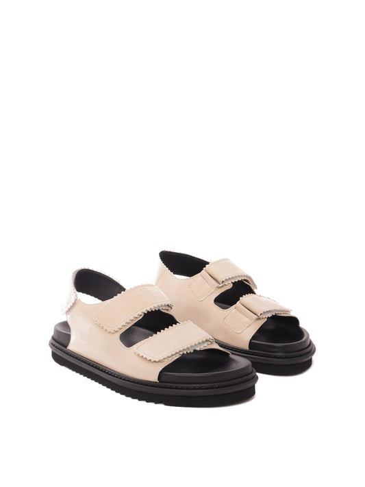 Tavira buttermilk leather sandal with two adjustable front straps and one back strap, front view.