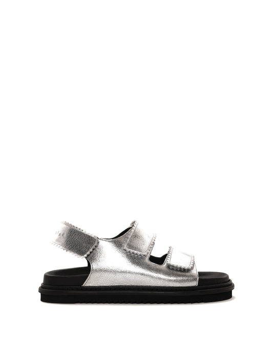 Tavira silver leather sandal with two adjustable front straps and one back strap, side view.