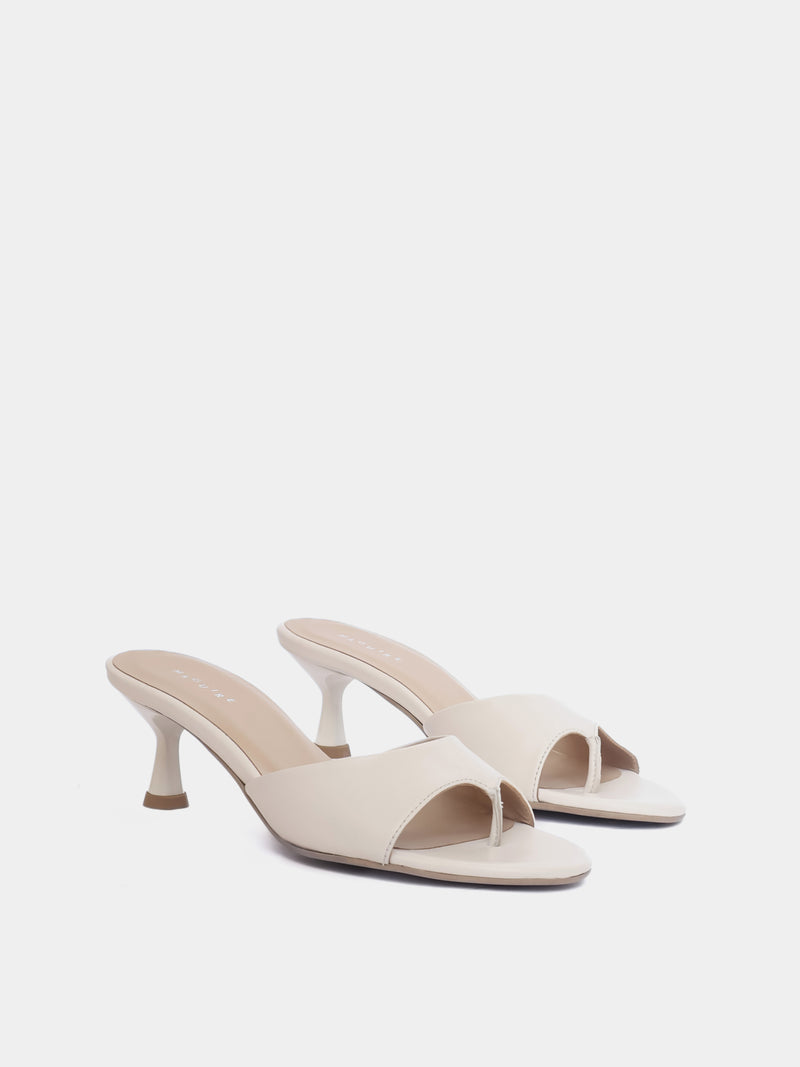 Front view of cream colored open toe heeled sandal on white background