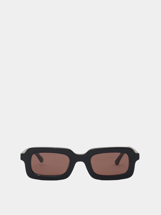 Rectangle shaped sunglasses in a black plastic colour with a brown lens. 