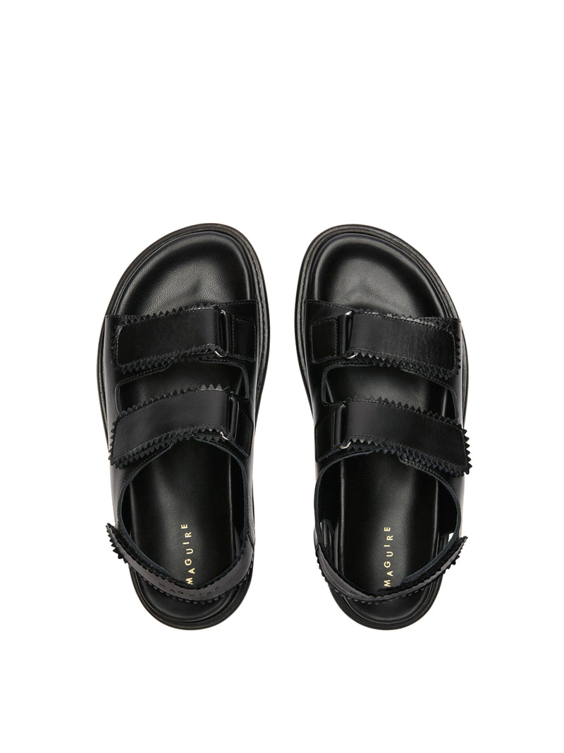 Tavira black leather sandal with two adjustable front straps and one back strap, top view.