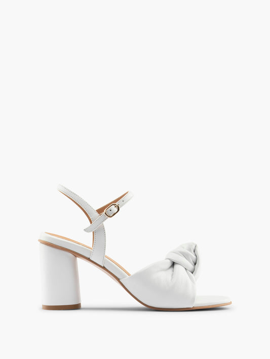 White high-heel with an ankle strap and leather knot