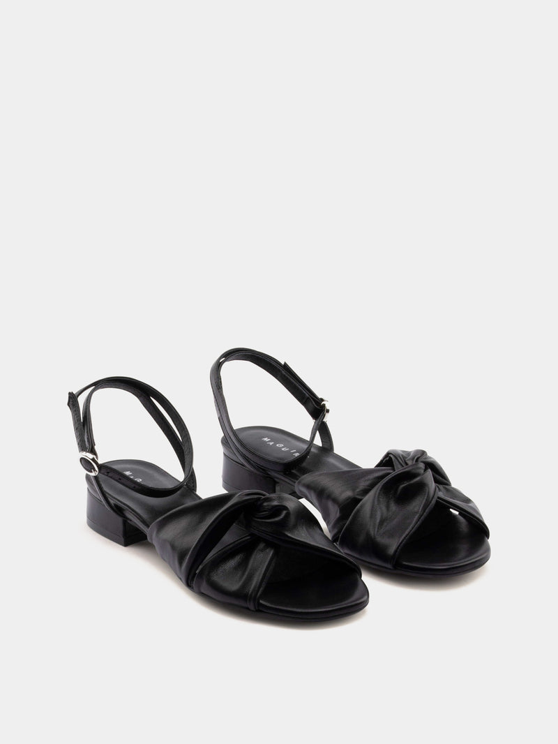black sandal on gray background