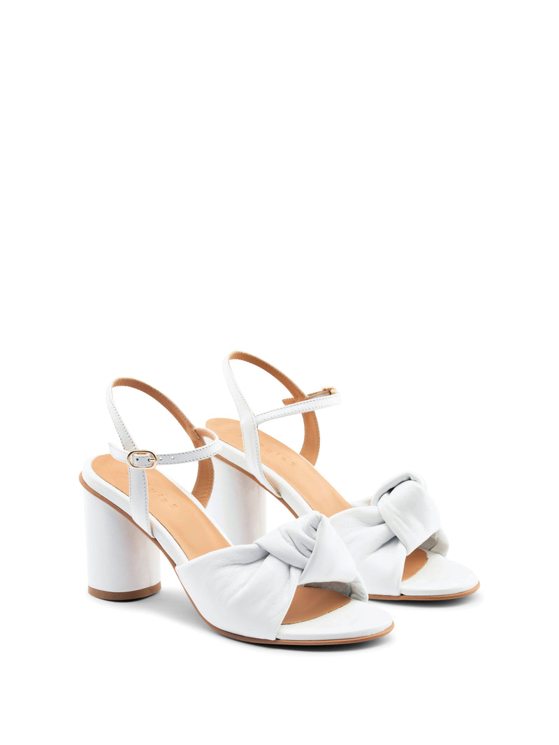 White high-heel with an ankle strap and leather knot