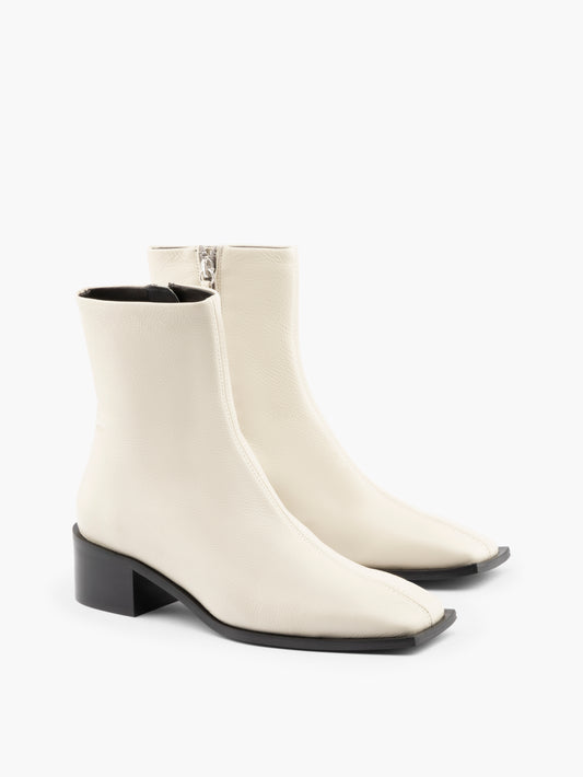 White leather ankle boots with a block heel
