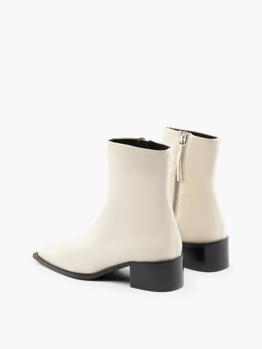 White leather ankle boots with a block heel