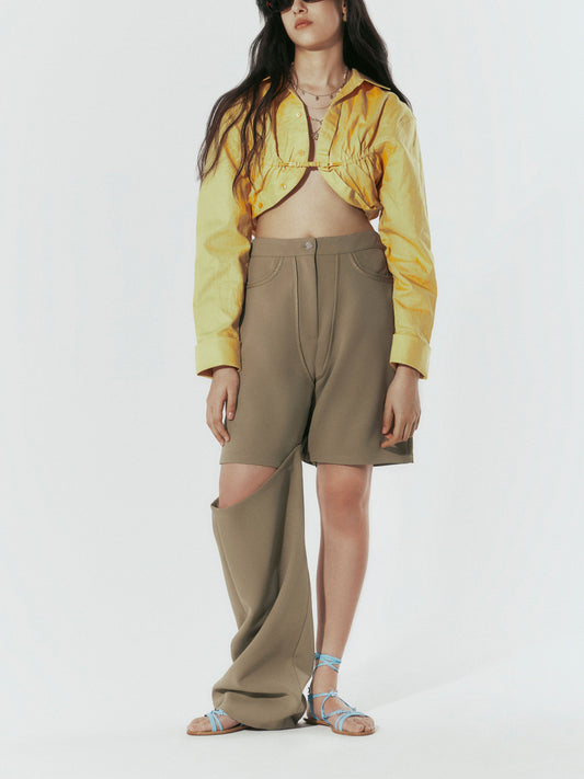 Sky Blue sandal worn with tan pants and yellow jacket