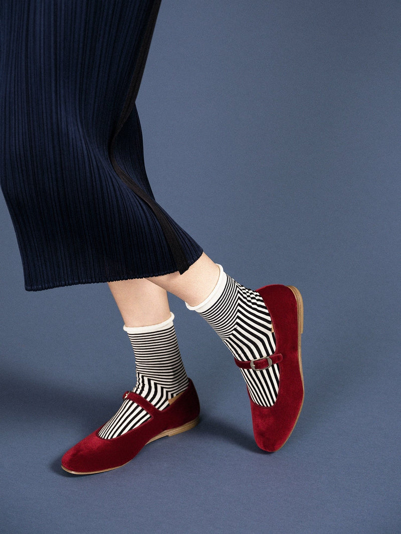 Striped socks with red shoes