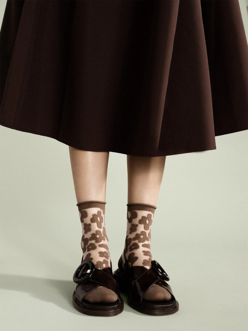 Brown Sheer Socks with flower with a brown skirt
